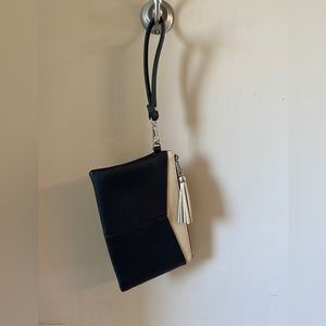 Black and tan vegan leather clutch